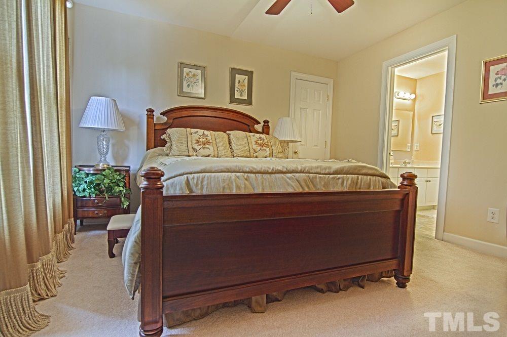 5305 Corbarron Court Raleigh, NC 27606 - Photo 16 of 21 Second bedroom with attached full bath, walk in closet and walk in attic/storage.