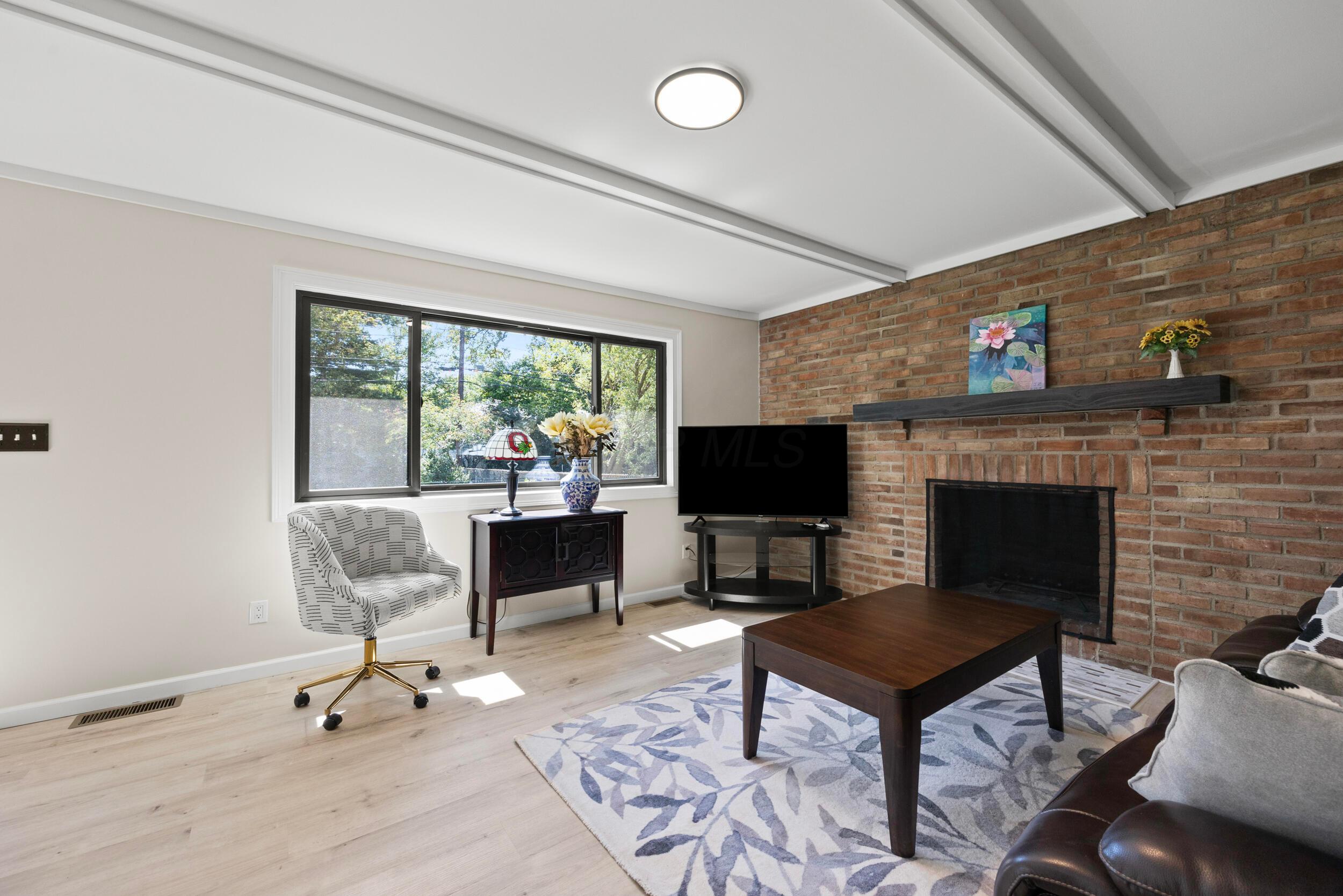 1415 Reymond Road Columbus, OH 43220 - Photo 19 of 36 Bright family room. Whole house features brand new windows.