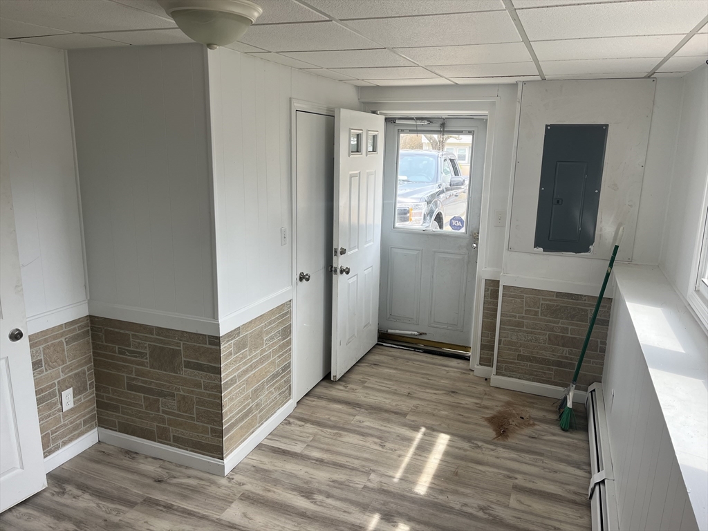 58 Brunswick Street Lowell, MA 01852 - Photo 20 of 33 a view of hallway with wooden floor
