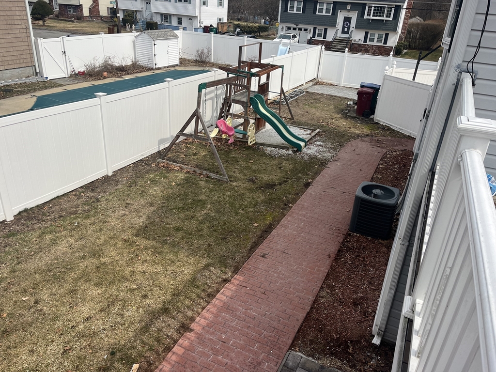 58 Brunswick Street Lowell, MA 01852 - Photo 28 of 33 a view of a backyard of the house