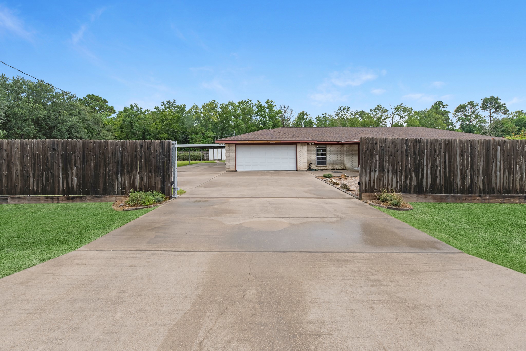 7315 Pine Street Manvel, TX 77578 - Photo 12 of 50 a view of house with backyard and wooden fence