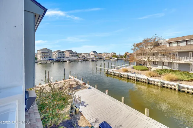 a bedroom with furniture and a large window