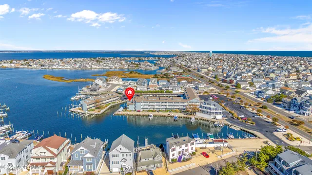 an aerial view of a houses with city view