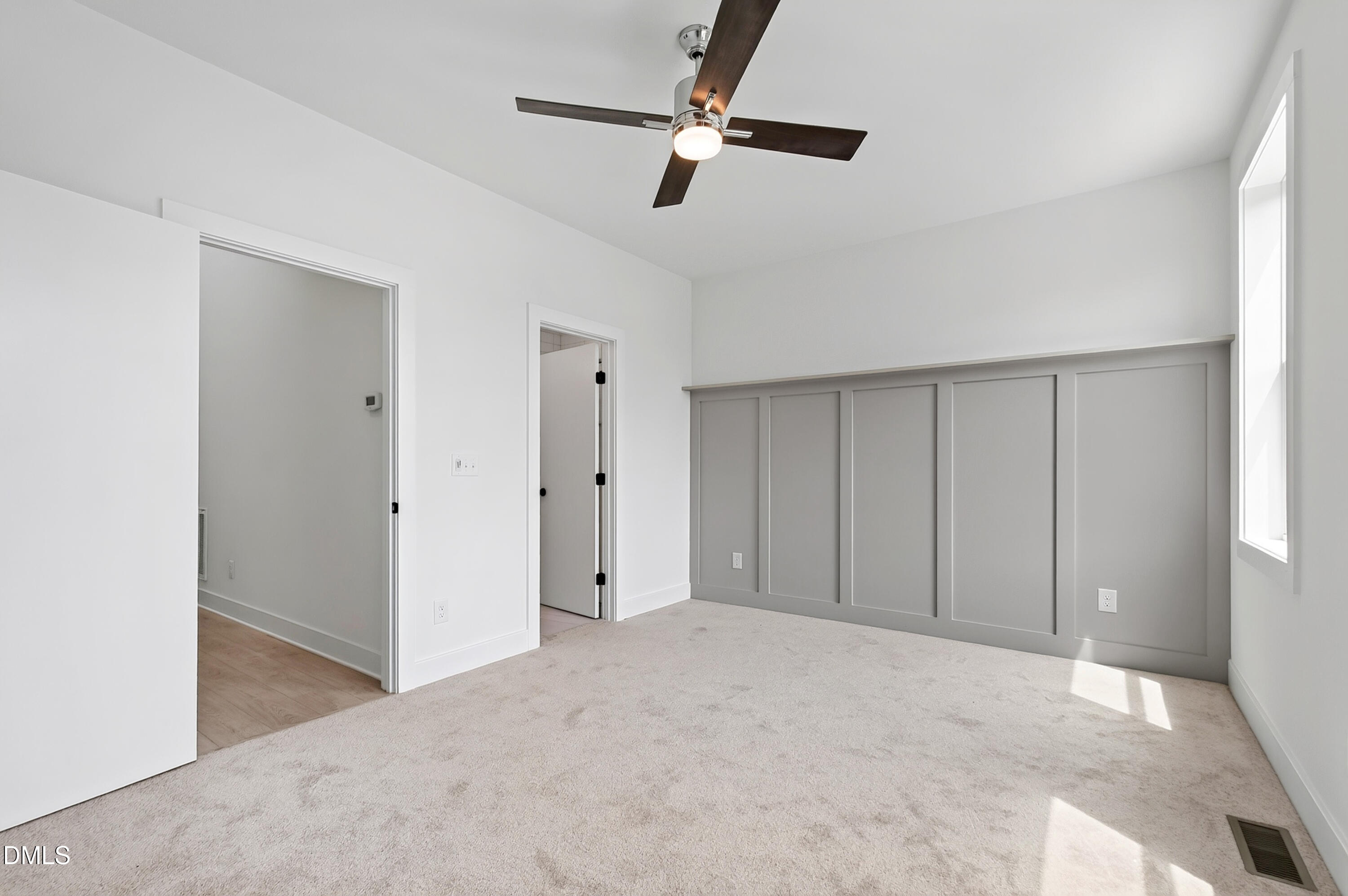 1317 Garner Road, Unit 102 Raleigh, NC 27610 - Photo 29 of 44 a view of a livingroom with a ceiling fan and entryway