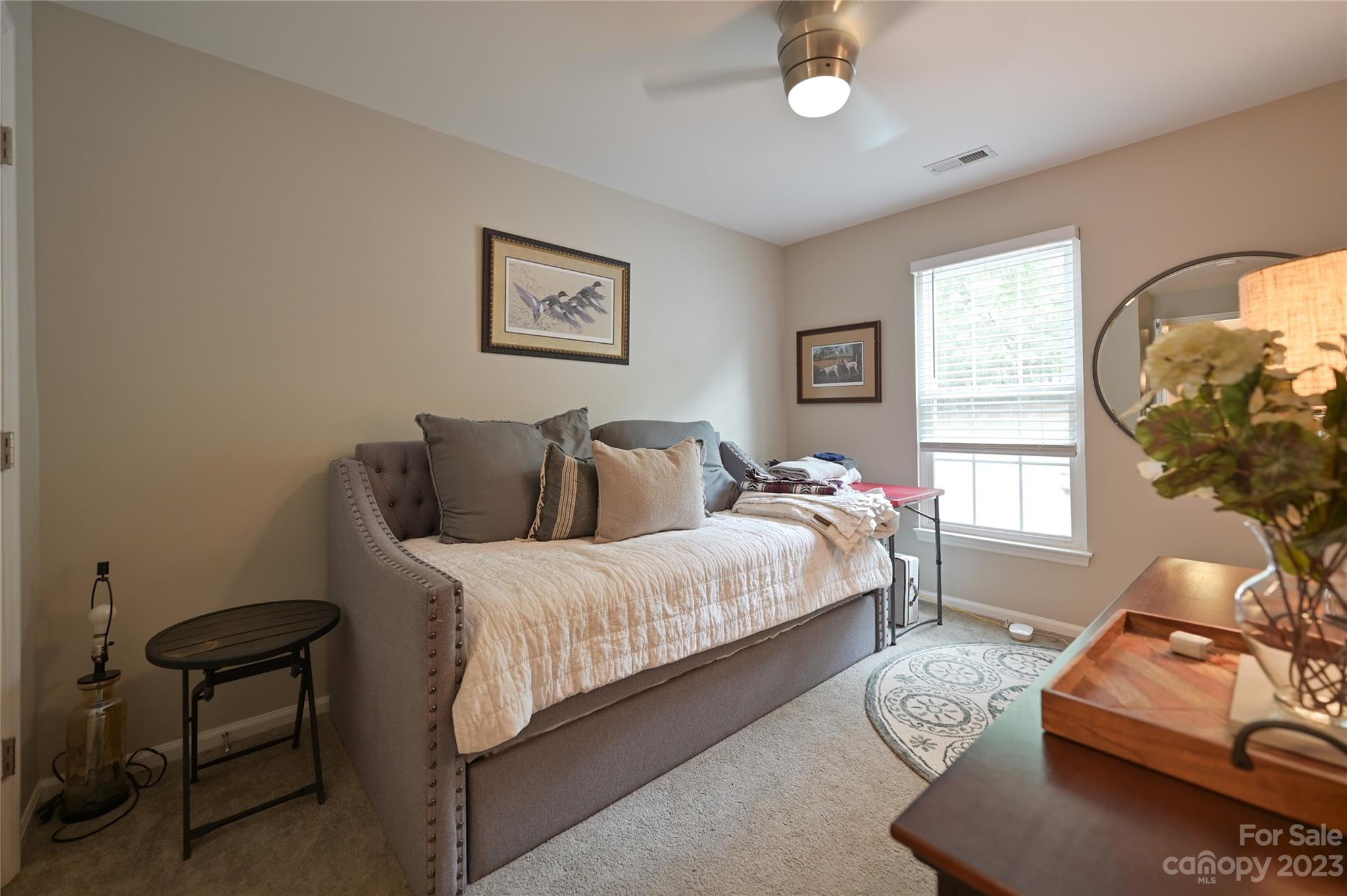 20109 Henderson Road, Unit D Cornelius, NC 28031 - Photo 15 of 18 a bedroom with bed and a window