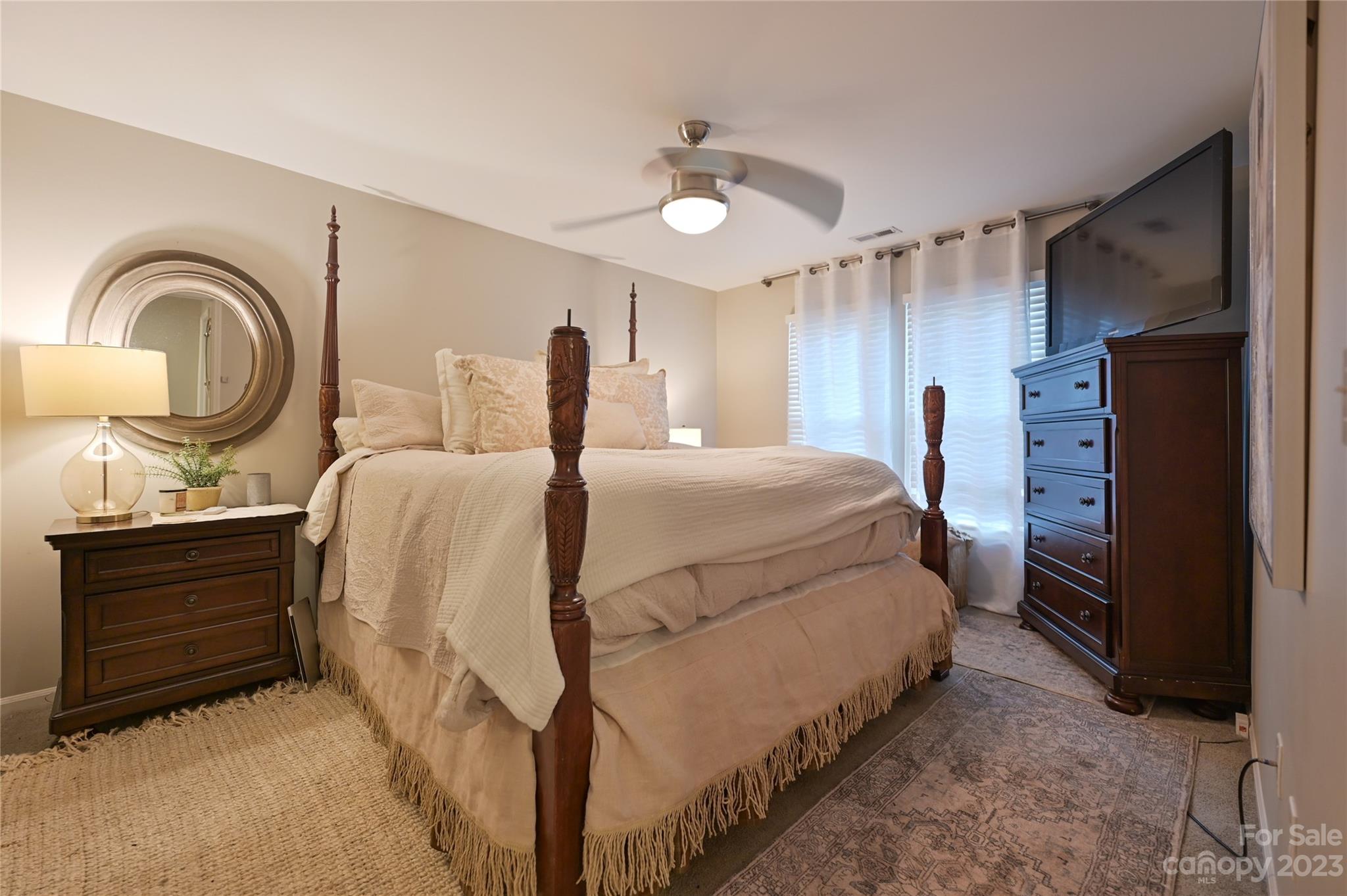 20109 Henderson Road, Unit D Cornelius, NC 28031 - Photo 17 of 18 a bed room with a bed and a dresser