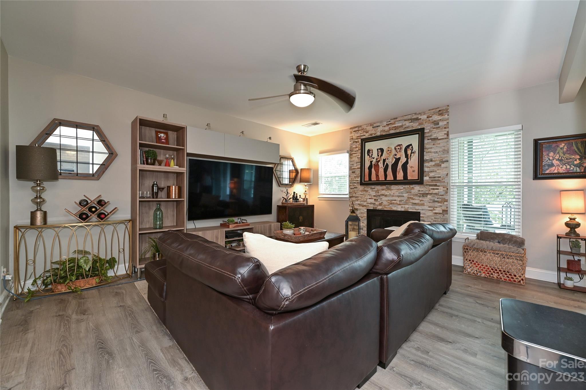 20109 Henderson Road, Unit D Cornelius, NC 28031 - Photo 6 of 18 a living room with furniture and a flat screen tv