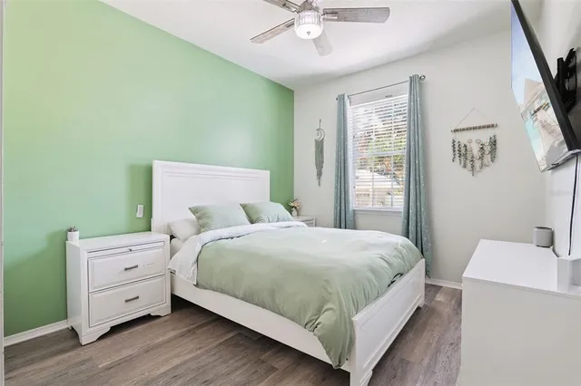 a bedroom with a bed and a window