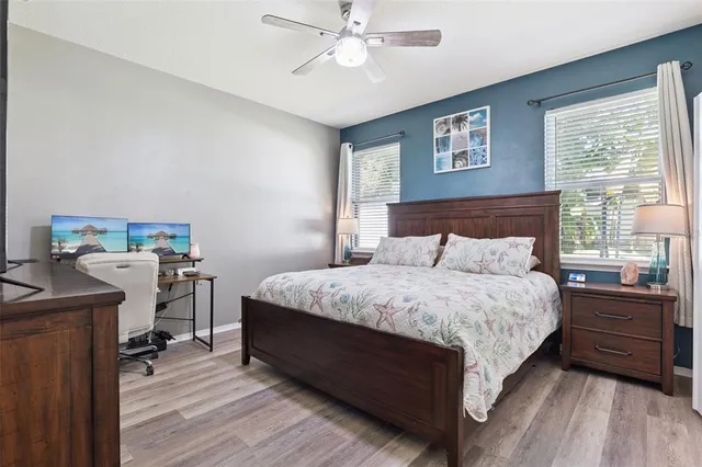 a bedroom with a bed and a desk