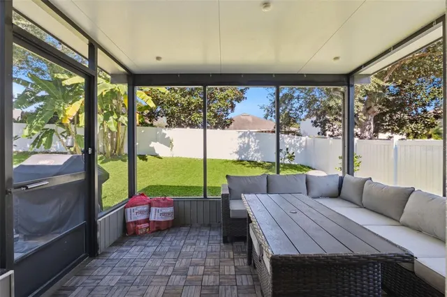 a couch sitting in a bedroom next to a window