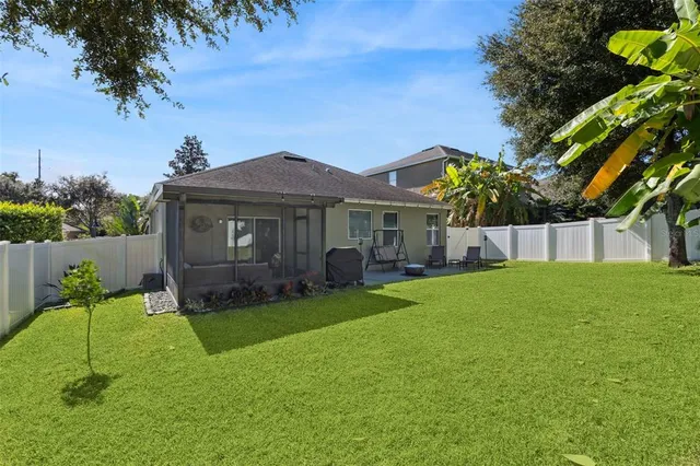 a view of a house with a backyard