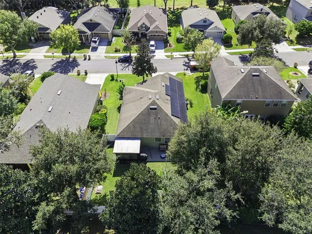 an aerial view of residential house with outdoor space and swimming pool