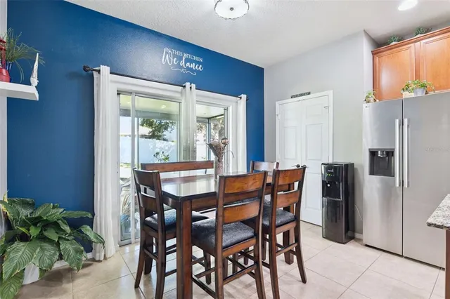 a dining room with furniture and window