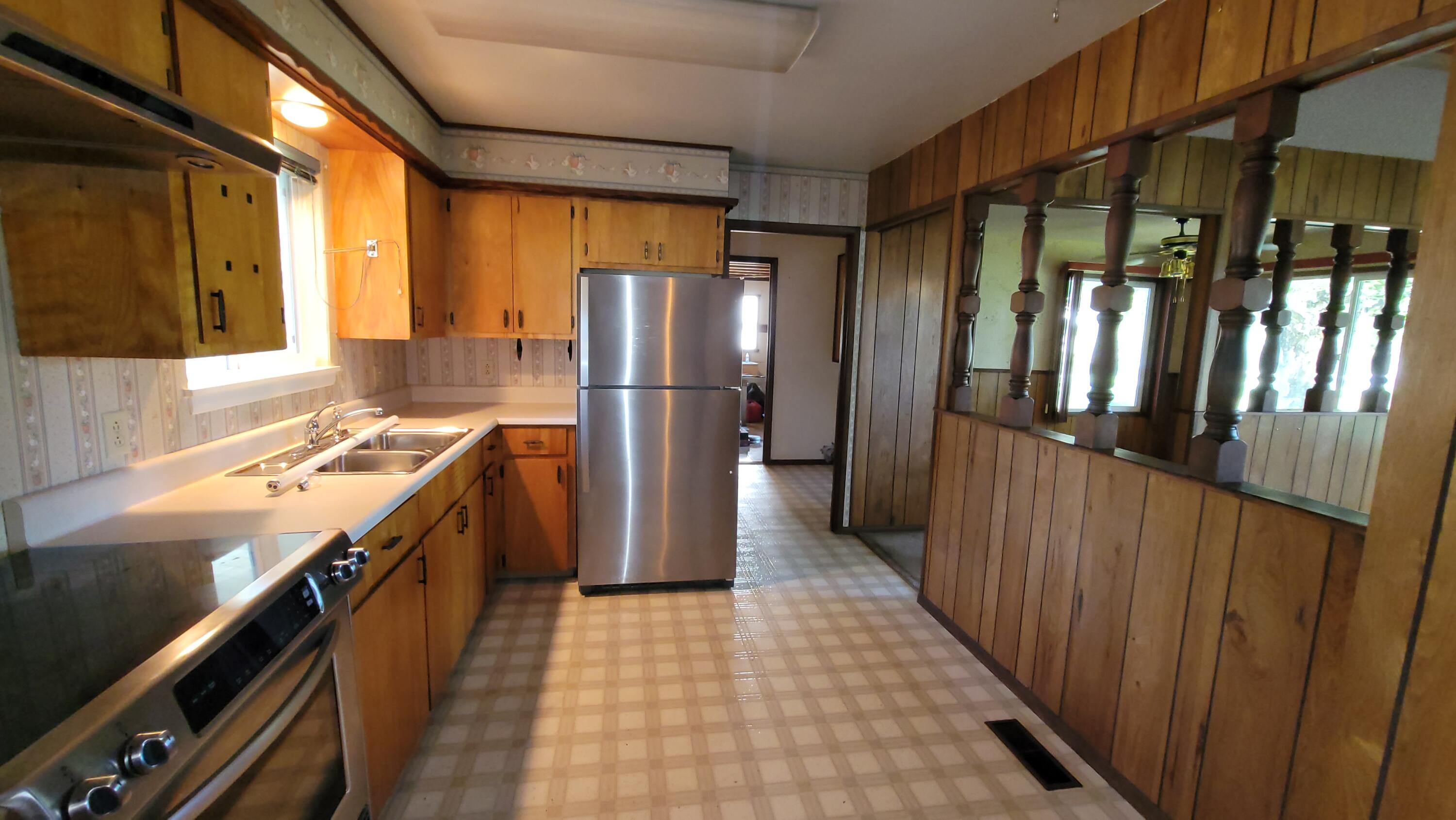 41916 Creighton Road Fall River Mills, CA 96028 - Photo 14 of 50 a kitchen with a refrigerator and a stove