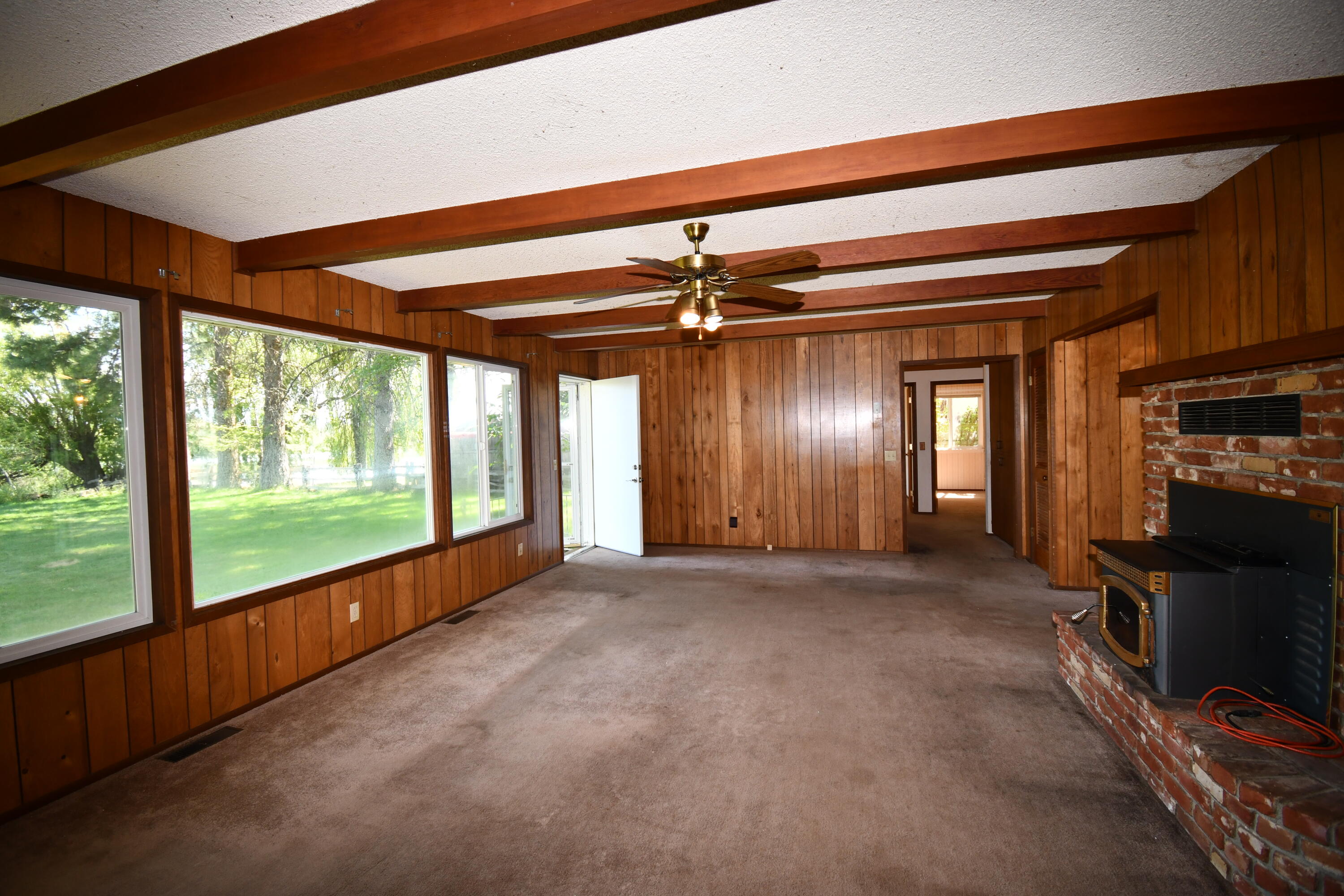 41916 Creighton Road Fall River Mills, CA 96028 - Photo 20 of 50 a view of empty room with wooden floor and fan