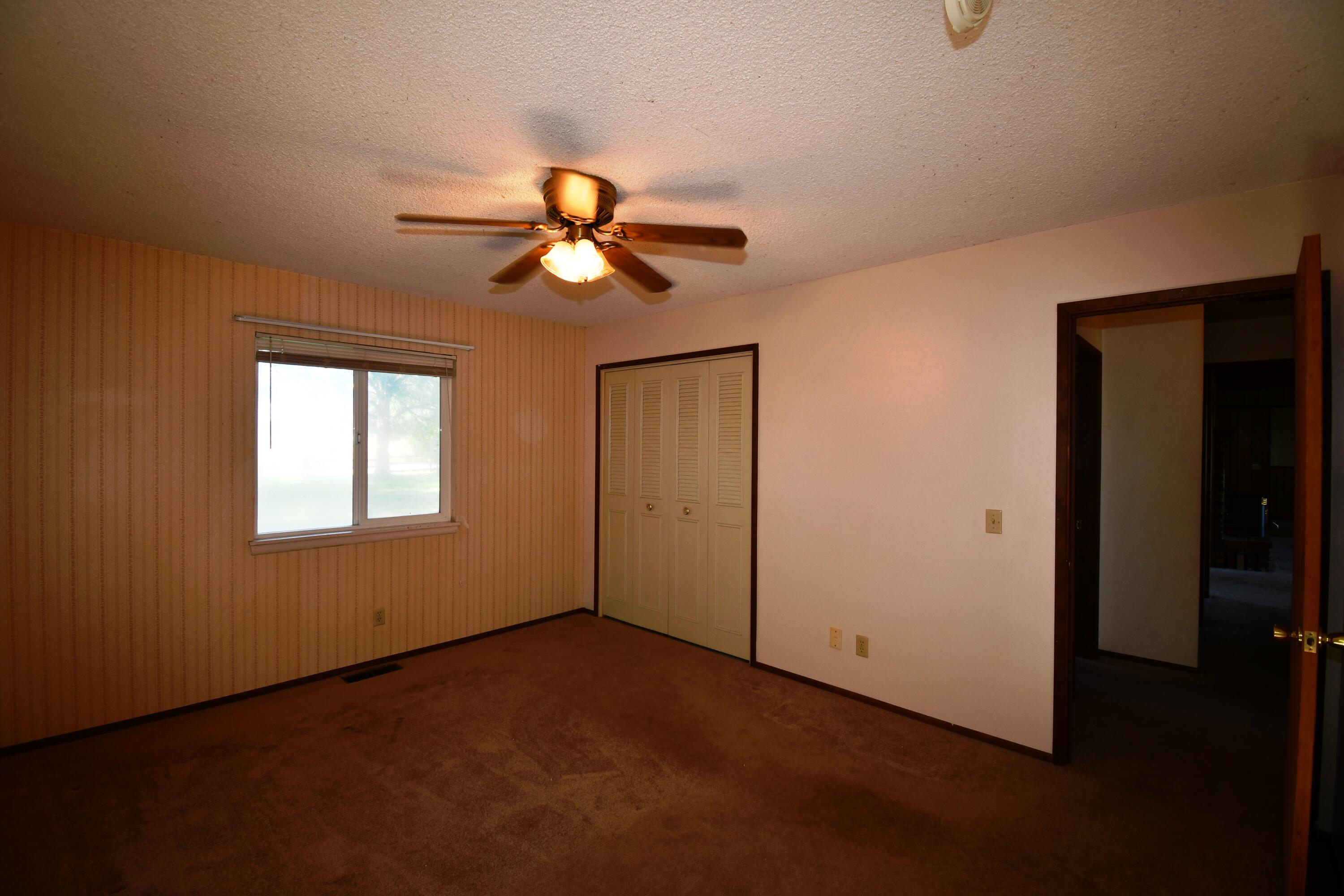 41916 Creighton Road Fall River Mills, CA 96028 - Photo 25 of 50 a view of a livingroom with a ceiling fan and window