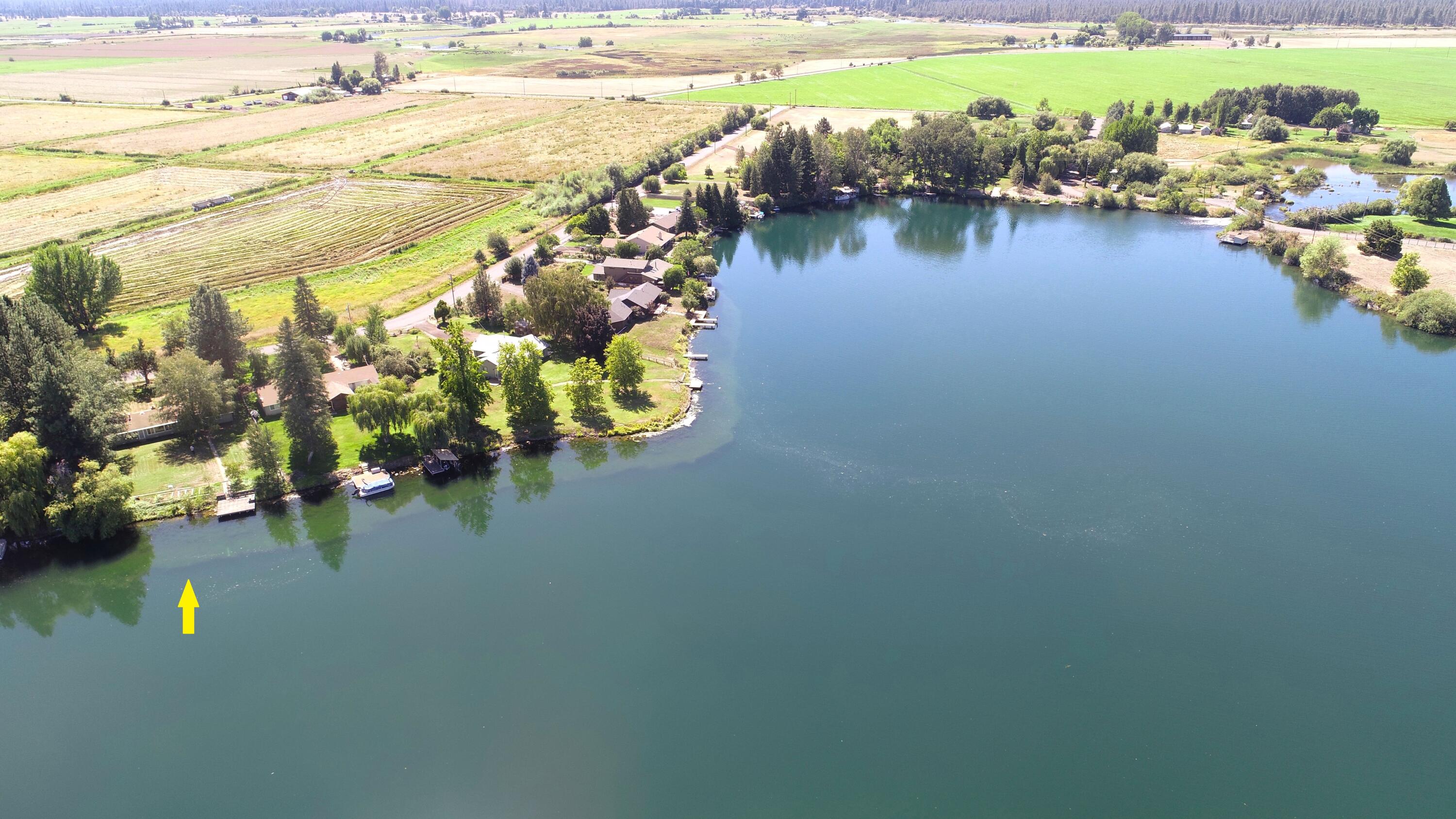 41916 Creighton Road Fall River Mills, CA 96028 - Photo 3 of 50 a view of a lake with lawn chairs