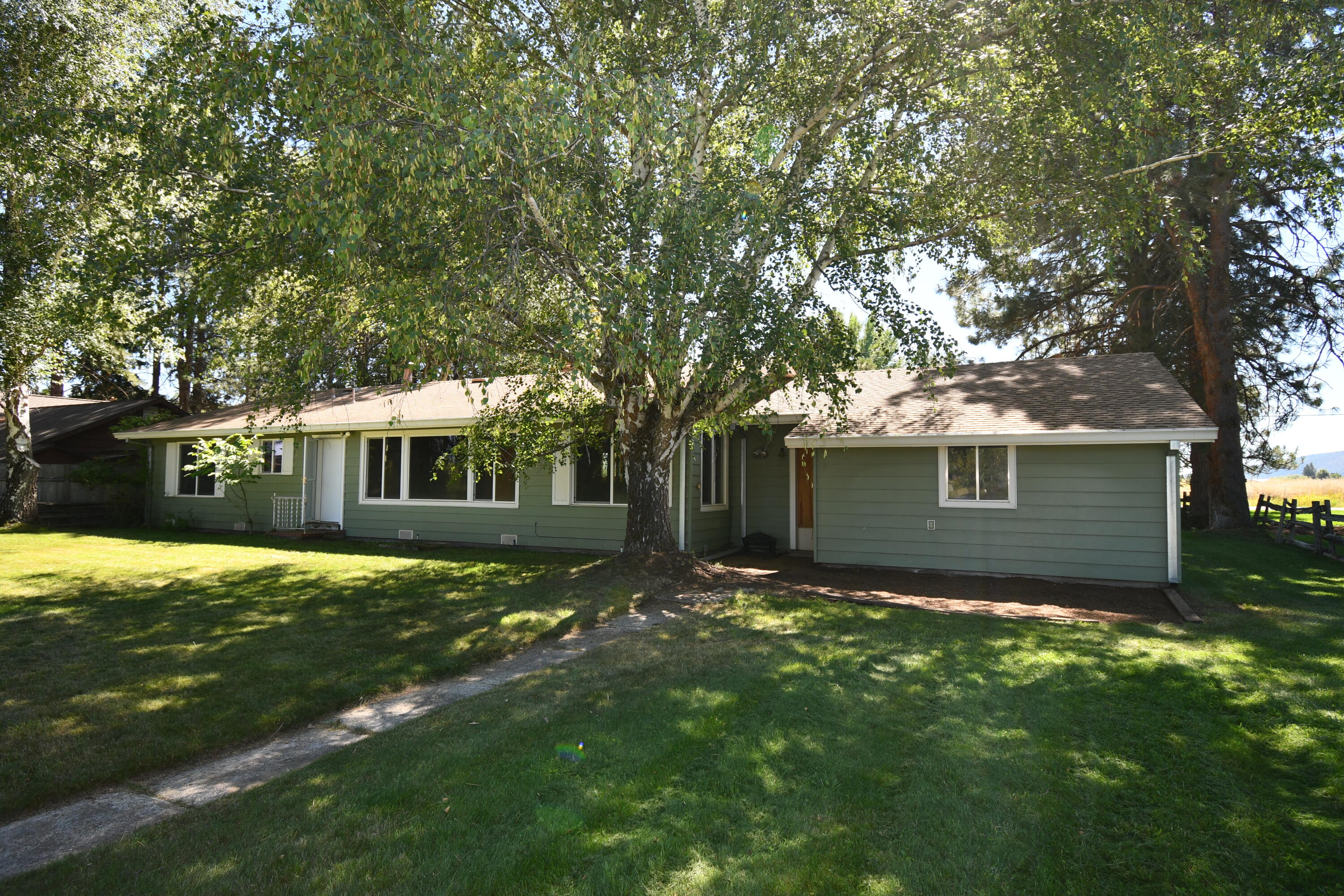 41916 Creighton Road Fall River Mills, CA 96028 - Photo 35 of 50 a view of a house with a yard