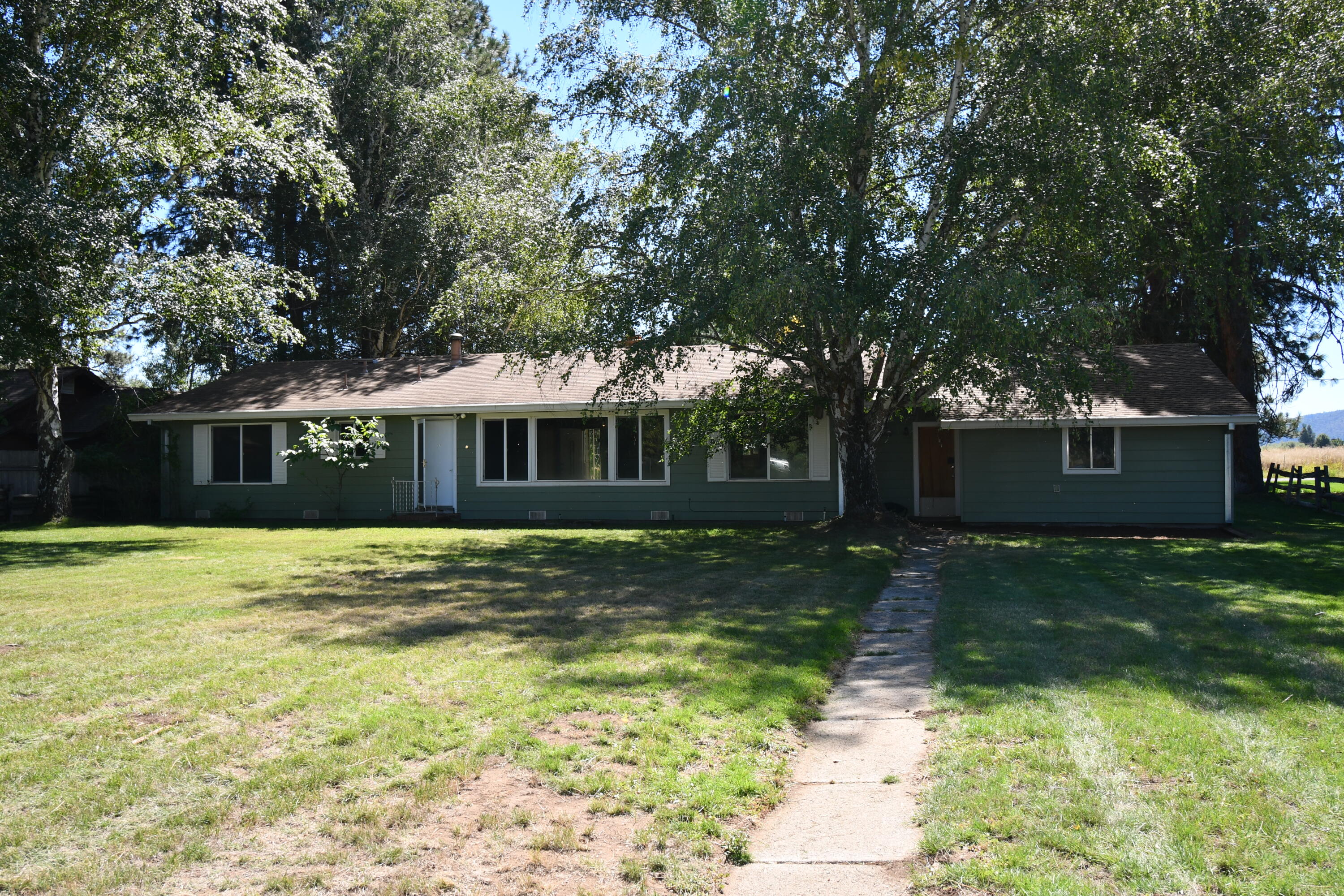 41916 Creighton Road Fall River Mills, CA 96028 - Photo 36 of 50 a front view of a house with a garden