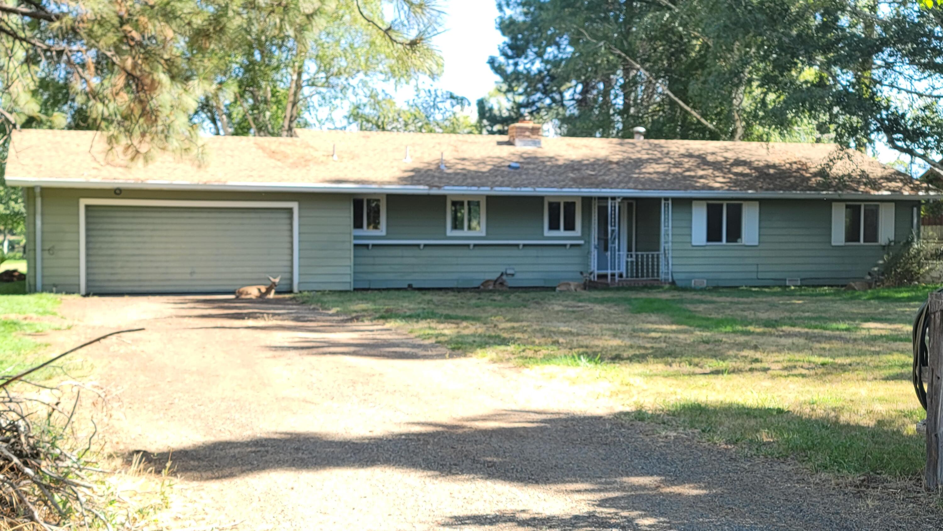 41916 Creighton Road Fall River Mills, CA 96028 - Photo 6 of 50 a front view of a house with a yard