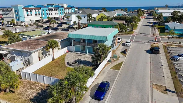 a view of multiple houses with a yard