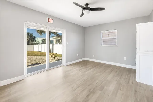 a view of an empty room with glass door