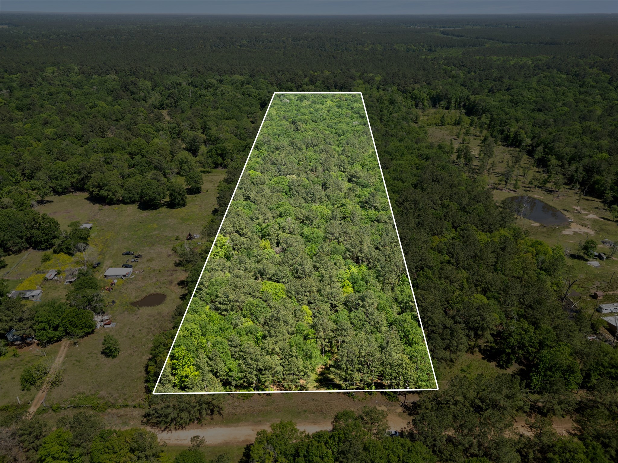 0 Maxine Lane Cleveland, TX 77328 - Photo 1 of 5 an aerial view of a yard