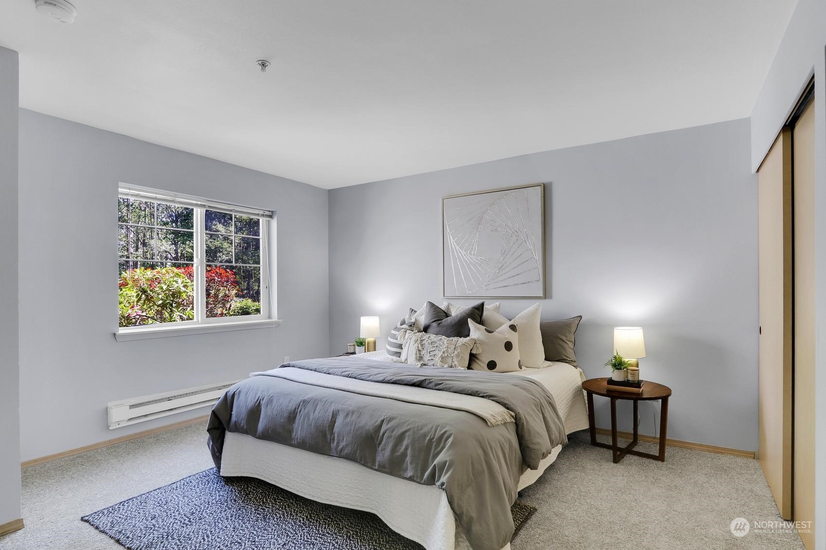 1001 West Casino Road, Unit C103 Everett, WA 98204 - Photo 11 of 23 a bedroom with a bed lamps and window