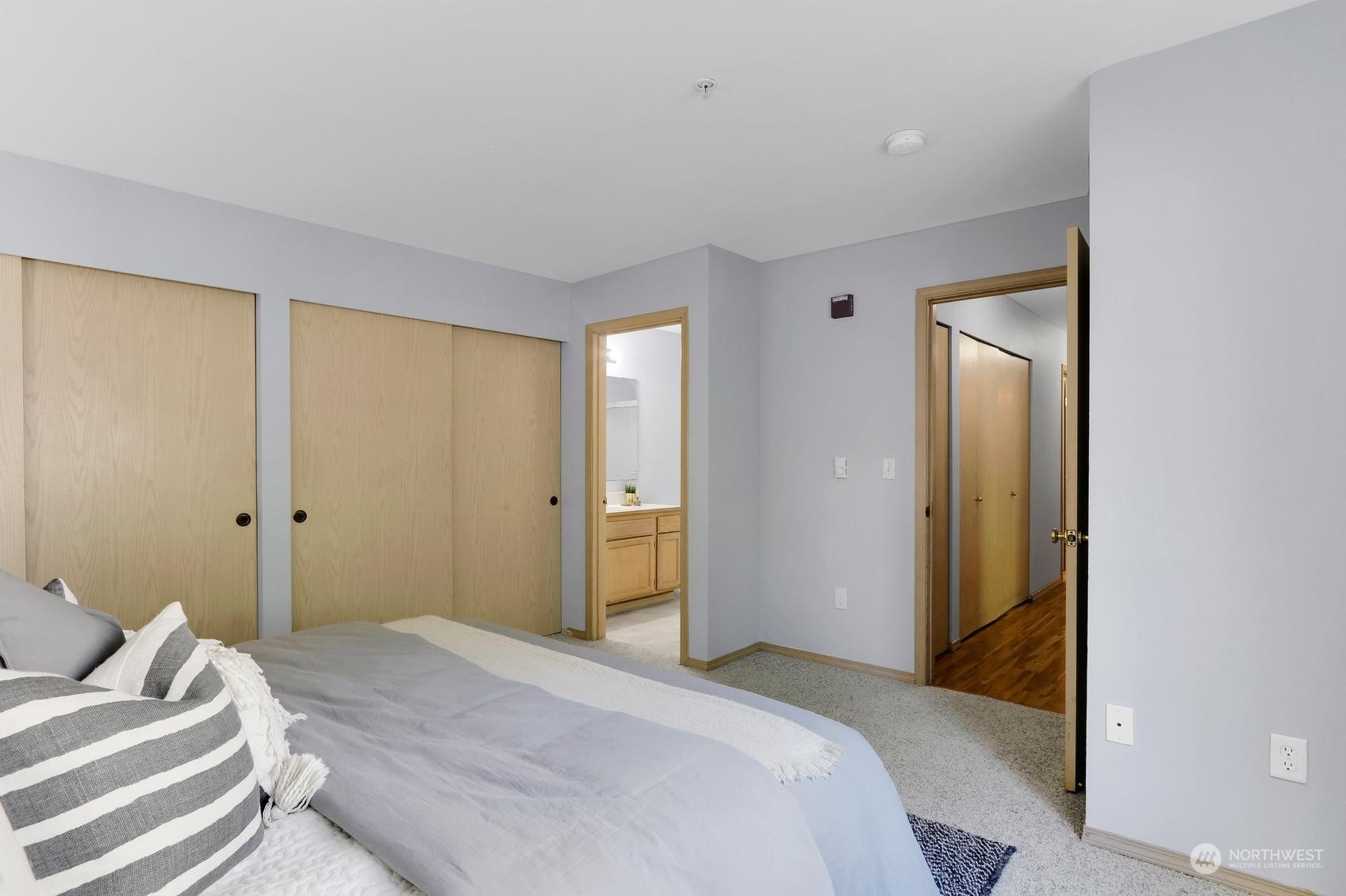 1001 West Casino Road, Unit C103 Everett, WA 98204 - Photo 12 of 23 a bedroom with a bed and a mirror