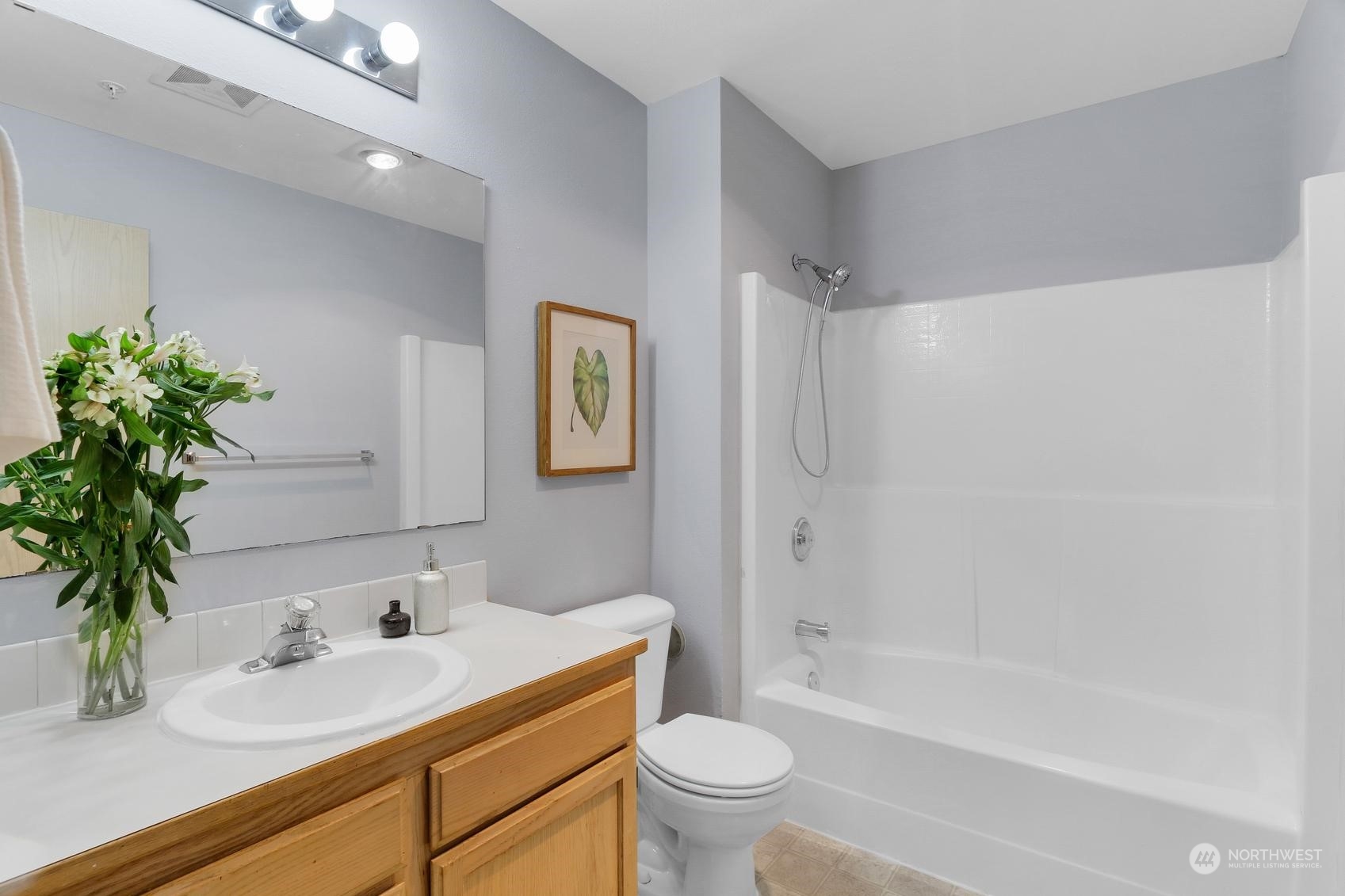 1001 West Casino Road, Unit C103 Everett, WA 98204 - Photo 16 of 23 a bathroom with a granite countertop sink a toilet and a bathtub