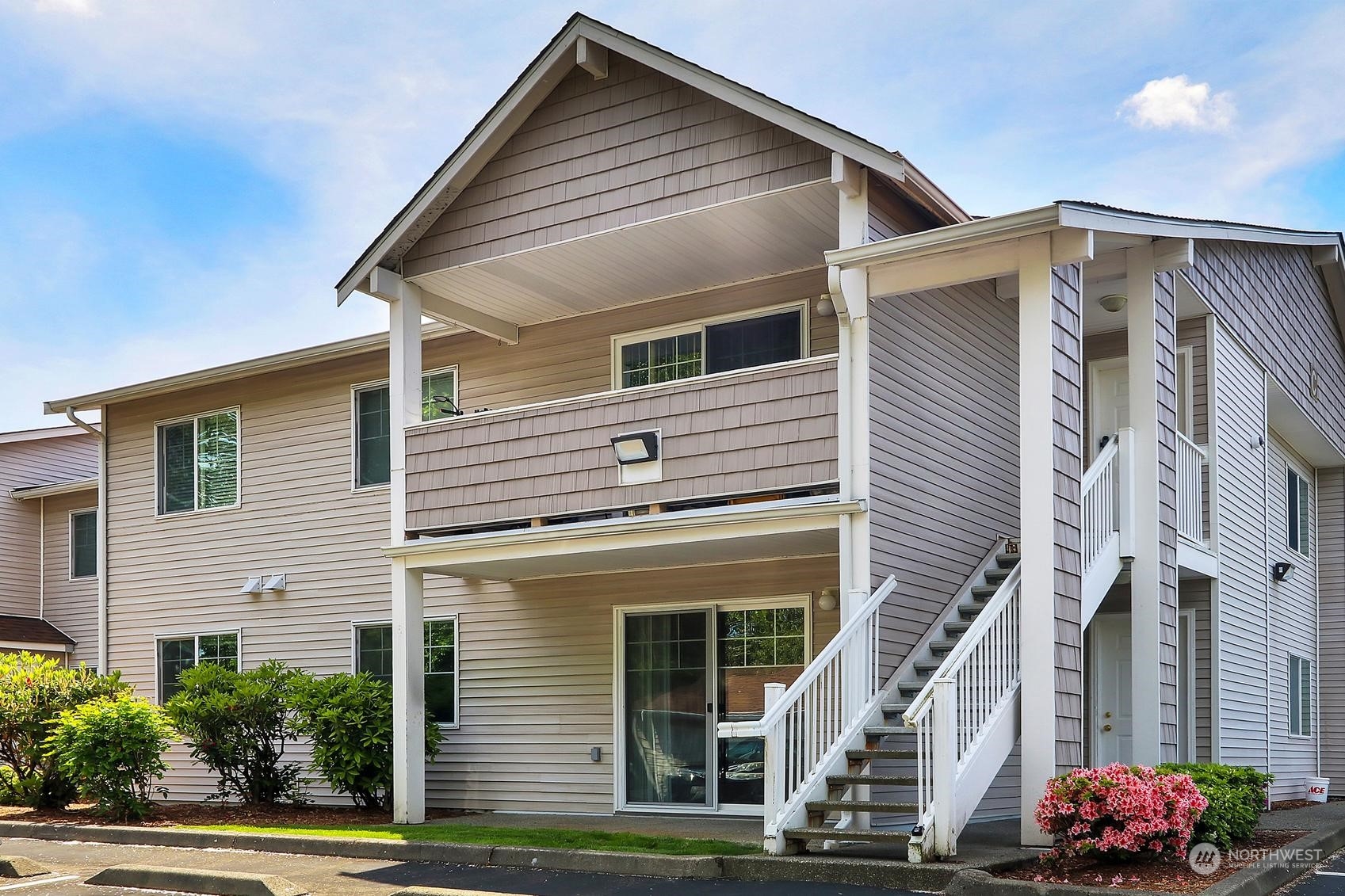 1001 West Casino Road, Unit C103 Everett, WA 98204 - Photo 22 of 23 a front view of a house with a yard