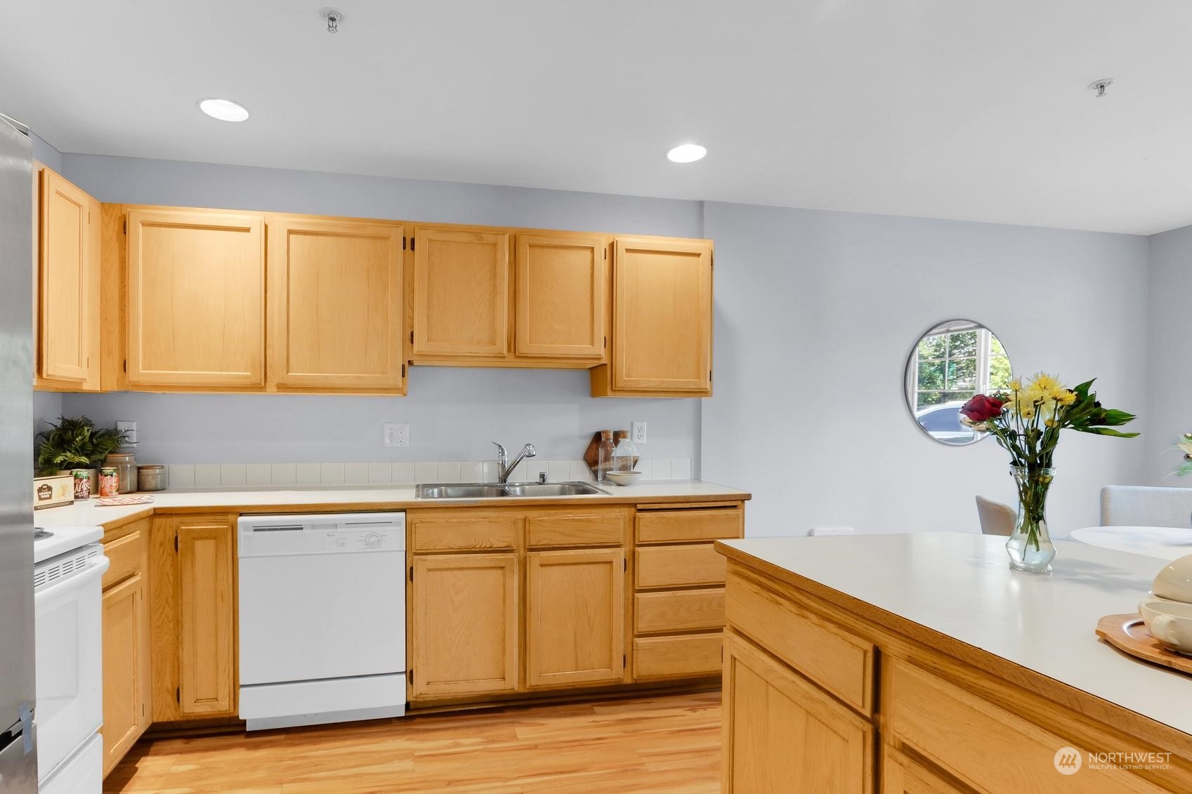 1001 West Casino Road, Unit C103 Everett, WA 98204 - Photo 8 of 23 a kitchen with a sink and cabinets