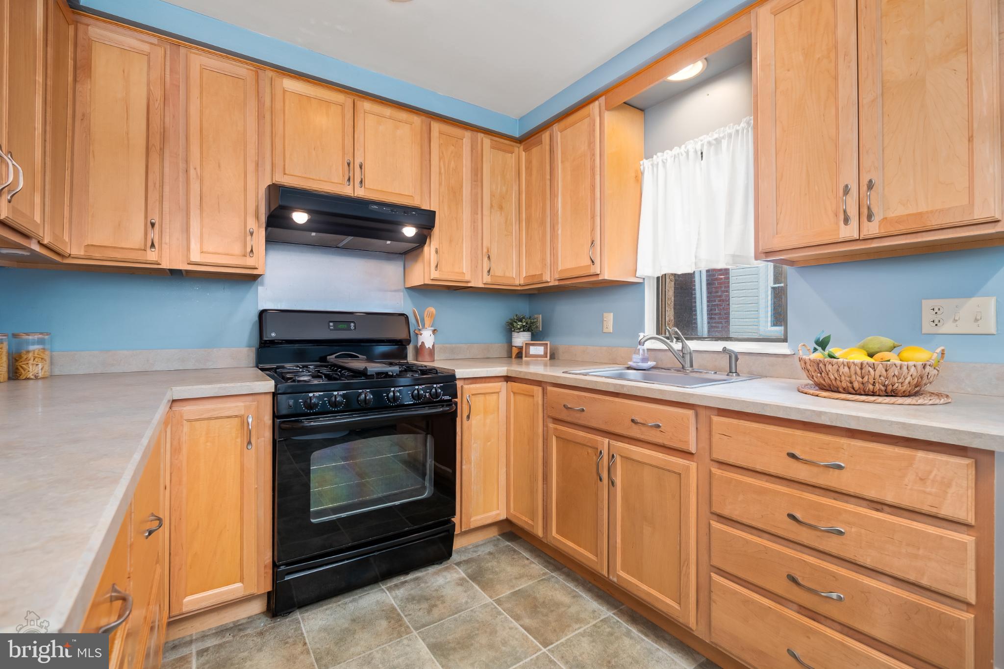 39 West Durham Street Philadelphia, PA 19119 - Photo 11 of 36 Charming kitchen with warm wood cabinetry.