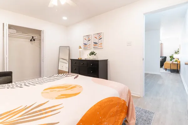 a bed sitting in a bedroom and a table