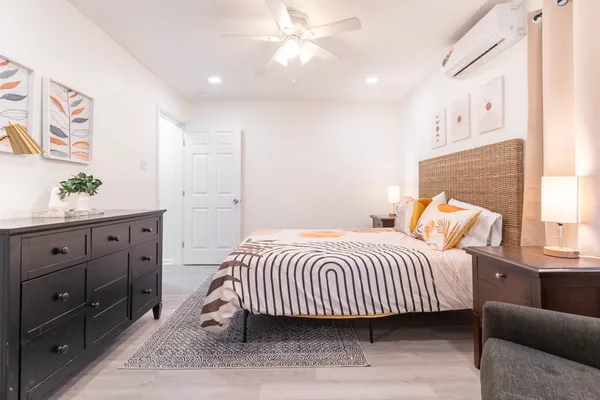 a bedroom with a bed and window