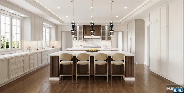 a kitchen with stainless steel appliances sink stove and wooden floor