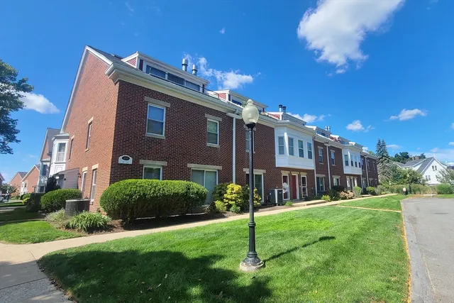 a view of a building with a yard