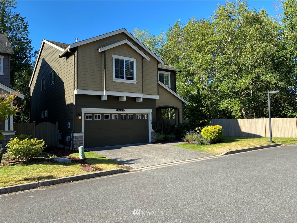 3406 176th Place Southeast Bothell, WA 98012 - Photo 1 of 19 a view of a house with backyard and a tree