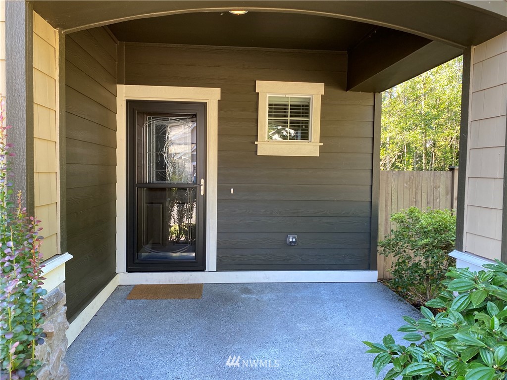 3406 176th Place Southeast Bothell, WA 98012 - Photo 2 of 19 a view of a front door and a yard
