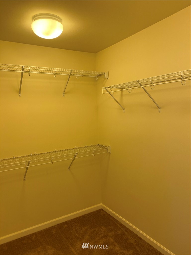 3406 176th Place Southeast Bothell, WA 98012 - Photo 12 of 19 a view of a room with racks on the wall