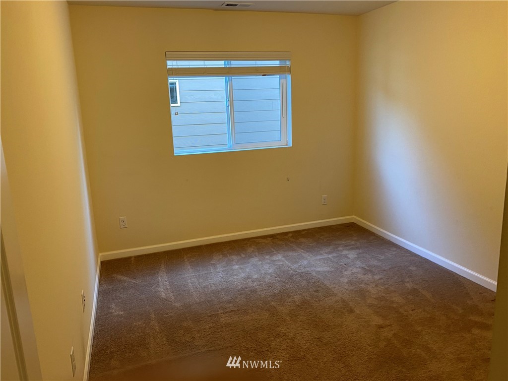 3406 176th Place Southeast Bothell, WA 98012 - Photo 13 of 19 a view of an empty room with a window