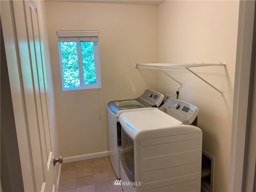 3406 176th Place Southeast Bothell, WA 98012 - Photo 16 of 19 a utility room with dryer and washer