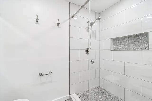 a view of a house with a large window and yard