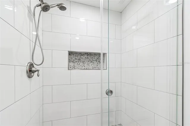 a view of a patio with table and chairs potted plants and a large tree