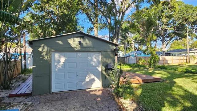 a view of an house with backyard space and garden