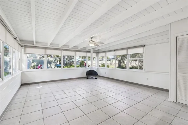 a view of an empty room with windows