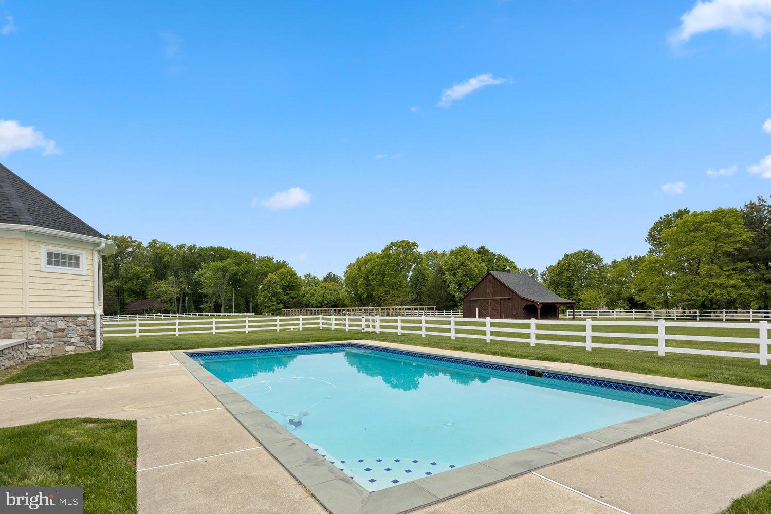 313 Wye Road Queenstown, MD 21658 - Photo 104 of 132 Tranquil poolside retreat in lush surroundings.