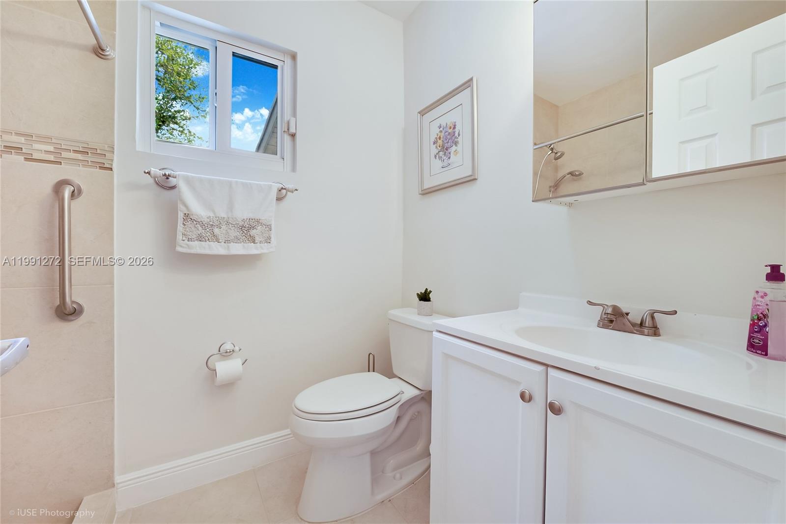 8535 Southwest 97th Road Miami, FL 33173 - Photo 18 of 28 a bathroom with a sink mirror vanity and toilet