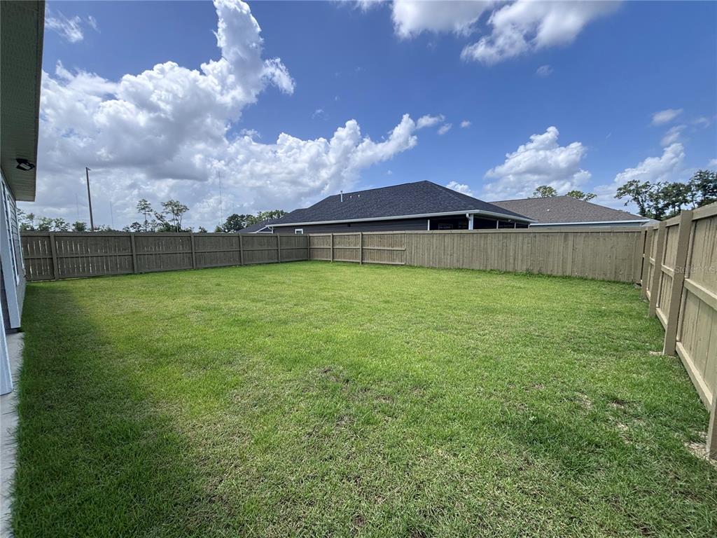 6686 Southwest 11th Lane Gainesville, FL 32607 - Photo 24 of 24 a view of a house with a yard