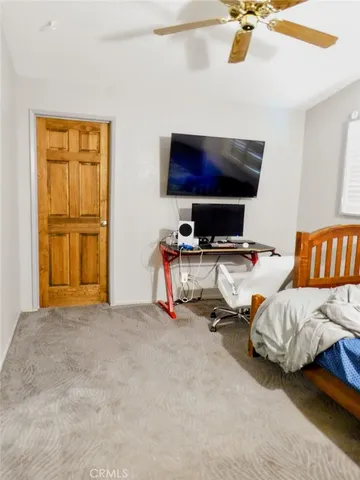 a room with furniture and flat screen tv